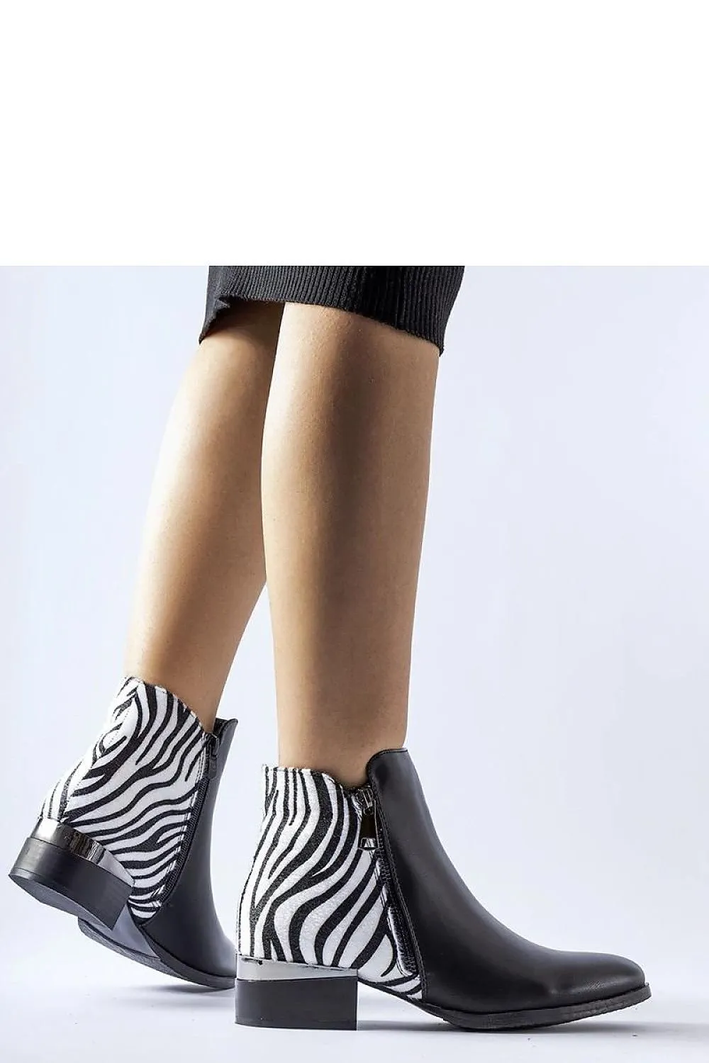 Black insulated ankle boots with a zebra pattern