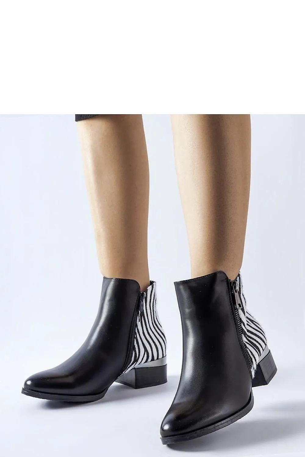Black insulated ankle boots with a zebra pattern